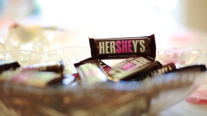 Fill in either "She" or "He" on a Hershey bar to represent the gender of the baby.